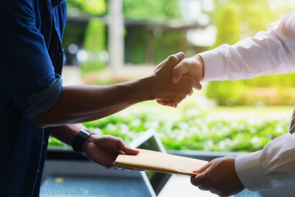 Businessman Negotiating a Joint Financial Transaction
